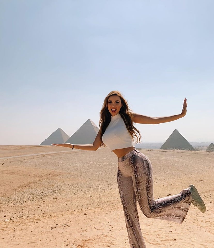 beautiful girl pausing in front of the pyramids of Giza - EZ TOUR EGYPT - Cairo and Nile Cruise by Flight - All in powerful 7 Days Trip